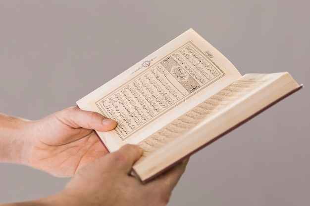 Quran in the hands of Muslim